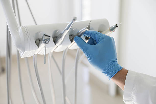 Professional Tooth Extraction technician working in MacDonnell Heights, NY